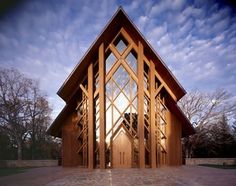 a large wooden building sitting on top of a stone floor