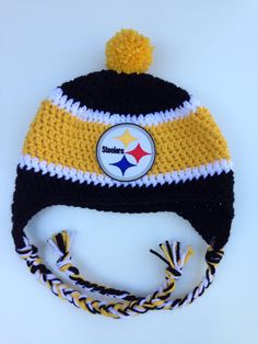 a black and yellow knitted hat with a pittsburgh football logo on it