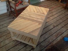 a wooden table sitting on top of a wooden deck