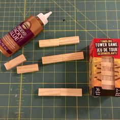 some wood pieces and glue sitting on a cutting board