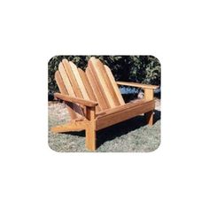 a wooden chair sitting in the grass