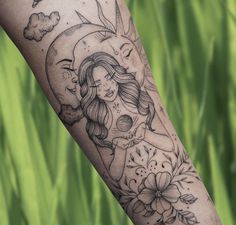 a woman's arm with flowers and a half moon tattoo on her left forearm