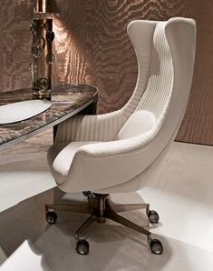 a white chair sitting in front of a table