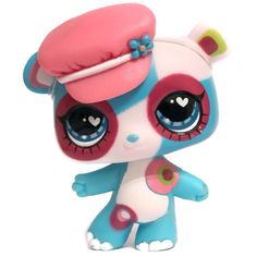 the littlest pet shop doll has big eyes and is wearing a blue outfit with pink ears