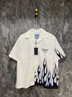 Trendy Shirt Designs For Men, Casual Streetwear Shirt With Embroidered Graphics, Prada Streetwear, 90s Inspired Streetwear T-shirt, Urban Button-up Shirt For Streetwear, White Graphic Print Windbreaker For Streetwear, Retro Button-up Shirt For Streetwear, Custom Jeans Diy, Trendy Shirt Designs