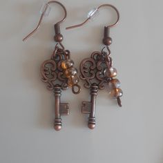 Beautiful Handcrafted Skeleton Key Earrings With 3 Sm Dangle Beads. Victorian/Reinassance Steampunk/Cosplay Skeleton Key Earrings, Steampunk Brown Jewelry For Gifts, Steampunk Brown Jewelry Gift, Steampunk Brown Jewelry For Gift, Brown Steampunk Jewelry Gift, Handmade Bronze Beaded Metal Earrings, Brown Metal Beaded Earrings For Gift, Gift Brown Beaded Metal Earrings, Handmade Adjustable Steampunk Earrings