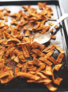 a spoon is sitting on top of some food that has been chopped into small pieces