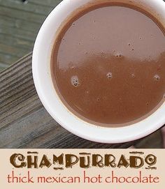 a person holding a cup of hot chocolate in their hand with the words, chapurado thick mexican hot chocolate