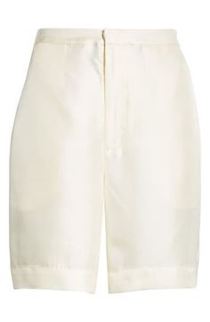 Chloé Harrouche's exacting elegance pervades handsome shorts tailored from silk twill with an elastic-eased high waist. Zip fly with hook-and-bar closure Back elastic waist Side-seam pockets; back welt pockets 100% silk Machine wash, dry flat Imported Designer Clothing Chic Formal Shorts With Short Inseam, Chic White Knee-length Shorts, Chic Beige Silk Bottoms, Chic Satin Shorts, Elegant Bermuda Shorts For Workwear, White Silk Bottoms For Summer, White Silk Summer Bottoms, Satin Shorts For Spring, White Satin Bottoms For Summer