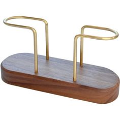 a wooden stand with two metal bars on it