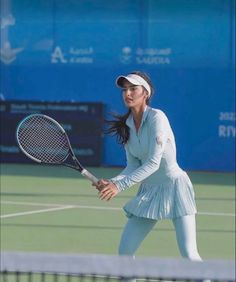 a female tennis player in action on the court