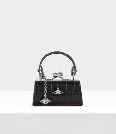 The croc-embossed Doll bag features a metal hanging orb charm with a glass sphere detail and a mini silhouette. Vivienne Westwood Mini Bag, Vivienne Westwood Black Bag, Vivienne Westwood Bag, Vivienne Westwood Accessories, Vivienne Westwood Clutch, Black Vivienne Westwood, Vivienne Westwood Bags, Doll Bag, Womens Designer Bags