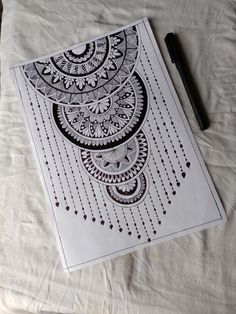 a white sheet with black and white designs on it