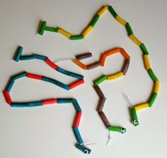 the colorful string is made from toothpicks and other colored sticks, which are attached to each other