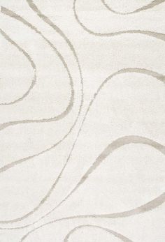 a white rug with wavy lines on it