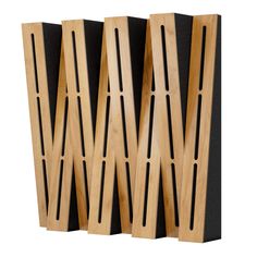 three pieces of wood are stacked on top of each other, with black panels behind them