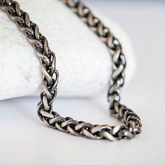 A stunning men's Spiga wheat chain necklace that has been oxidised to give a beautiful gunmetal finish Featuring a weight of 33g, this heavy and unique wheat chain necklace is crafted from the finest sterling silver and makes the perfect gift for a special man. This stylish and robust necklace is perfect for everyday wear and is ideal for medium to large pendants or for wearing alone. An ideal gift for someone who is conscious about what they buy or wear, it doesn't matter if he's dressing up or Matching Bracelet, It Doesn't Matter, Oxidized Sterling Silver, Matching Bracelets, Matching Necklaces, Doesn't Matter, Chain Link Bracelet, Chain Bracelet, Personalized Jewelry