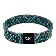 Sahara wristband bracelet. Available sizes:  Extra Small 5.5" (petites + kids) Small 6.5" (most common fitting size) Medium 7.5" (large wrists) Large or Anklet 8.5" (very large wrists or anklet) 1/2" Width Reversible Southwest, Tribal and Aztec prints. Elastic blend material, can stretch to desired fit. Packaged in natural drawstring gift pouches. Machine washable. Chlorine and saltwater safe. Adjustable Casual Wristband Bracelet, Casual Festival Bangle Stretch Bracelet, Casual Stretch Bangle Bracelet For Festival, Casual Festival Stretch Bangle Bracelet, Casual Turquoise Bracelets For Festivals, Adjustable Black Band Bracelet For Festivals, Adjustable Band Bracelet Casual Style, Blue Flexible Casual Bracelet, Casual Band Bracelets For Friendship