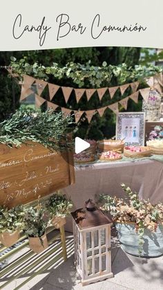 a table topped with lots of cakes and desserts next to a sign that says candy bar community