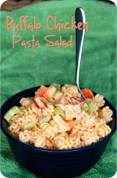 a bowl filled with pasta and chicken on top of a green cloth