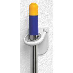 a blue and yellow object is attached to a white wall mounted hook on the side of a building