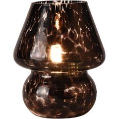 a brown glass vase with a light in the middle