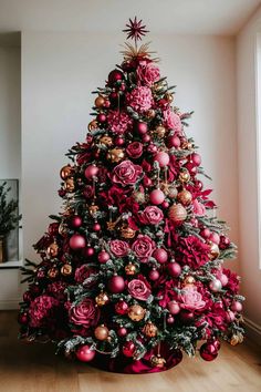 a christmas tree decorated with red and gold ornaments