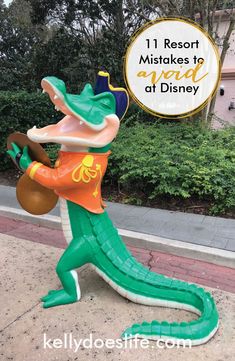 an inflatable alligator statue with the words, 1 resort mistakes to at disney