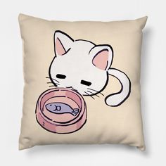 a white cat is eating out of a bowl on a pillow that has a fish in it