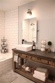 a bathroom with a sink, mirror and bathtub