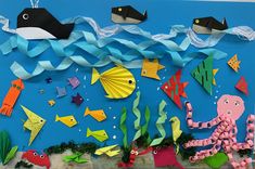 an ocean scene made out of paper with fish, octopus, and other sea creatures