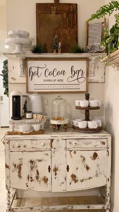 an old buffet table with coffee cups and plates on it