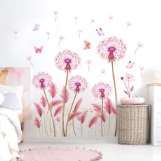 a bedroom with pink flowers and butterflies on the wall