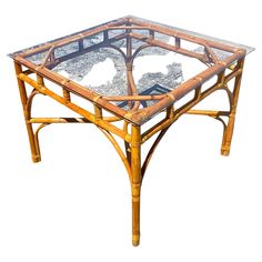 a table with glass top and bamboo frame