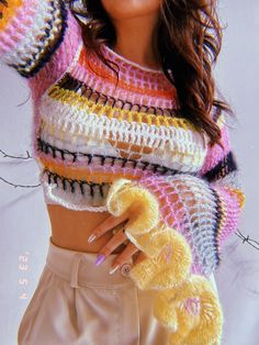 a close up of a person wearing a knitted sweater