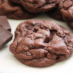 chocolate cookies and pieces of chocolate on a plate