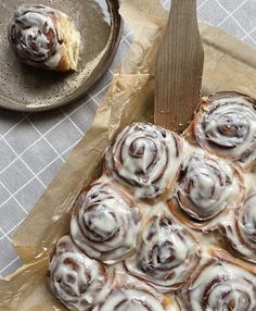 there are many donuts on the table and one has frosted them with icing