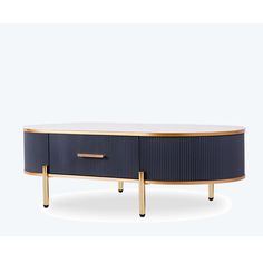 a blue and gold coffee table with two drawers