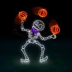 a skeleton juggling balls in the dark