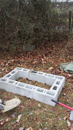 the concrete blocks are laid out on the ground to be used as a planter