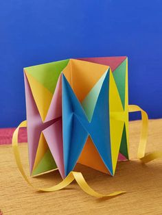 an origami box sitting on top of a table