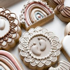 decorated cookies are displayed on a table