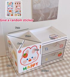 the toy box is made to look like it has hello kitty stickers on it