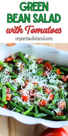 green bean salad with tomatoes and parmesan cheese in a casserole dish