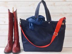 Navy Canvas Tote Bag,  Blue Sapphire Tote bag Unisex Durable and Versatile Waxed canvas bag It has Key Fob, top handles, and an adjustable strap, so you can carry it in-hand or on your shoulder or crossbody. Webbing strap shortest makes shoulder strap.Fully lined with Orange color fabric. BAG FEATURES:• Handmade at my HOME ATELIER• 14 OZ Navy Waxed canvas • Fully lined with 14 oz waterproof fabric.• Key Holder• Inside 1 LARGE ZIPPER and 5 useful pockets• 6 " Drop Handle• Webbing Crossbody / Shou Navy Satchel Shoulder Bag For On-the-go, Travel Canvas Bag With Adjustable Handle, Canvas Travel Bag With Adjustable Handle, Navy Shoulder Bag With Top Carry Handle For On-the-go, Blue Canvas Shoulder Bag With Handles, Travel Canvas Satchel With Adjustable Handle, Blue Canvas Satchel Bag With Handles, Everyday Navy Bag With Handles, Blue Canvas Satchel With Handles