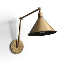 an image of a wall light on the side of a white wall with a black and gold shade