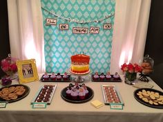 a table topped with lots of desserts and cakes