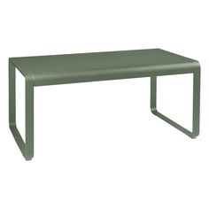 a green table sitting on top of a white floor