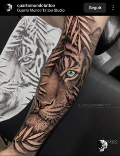 a tiger with blue eyes on the arm