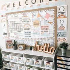 a bulletin board with the word hello written on it in front of some bins